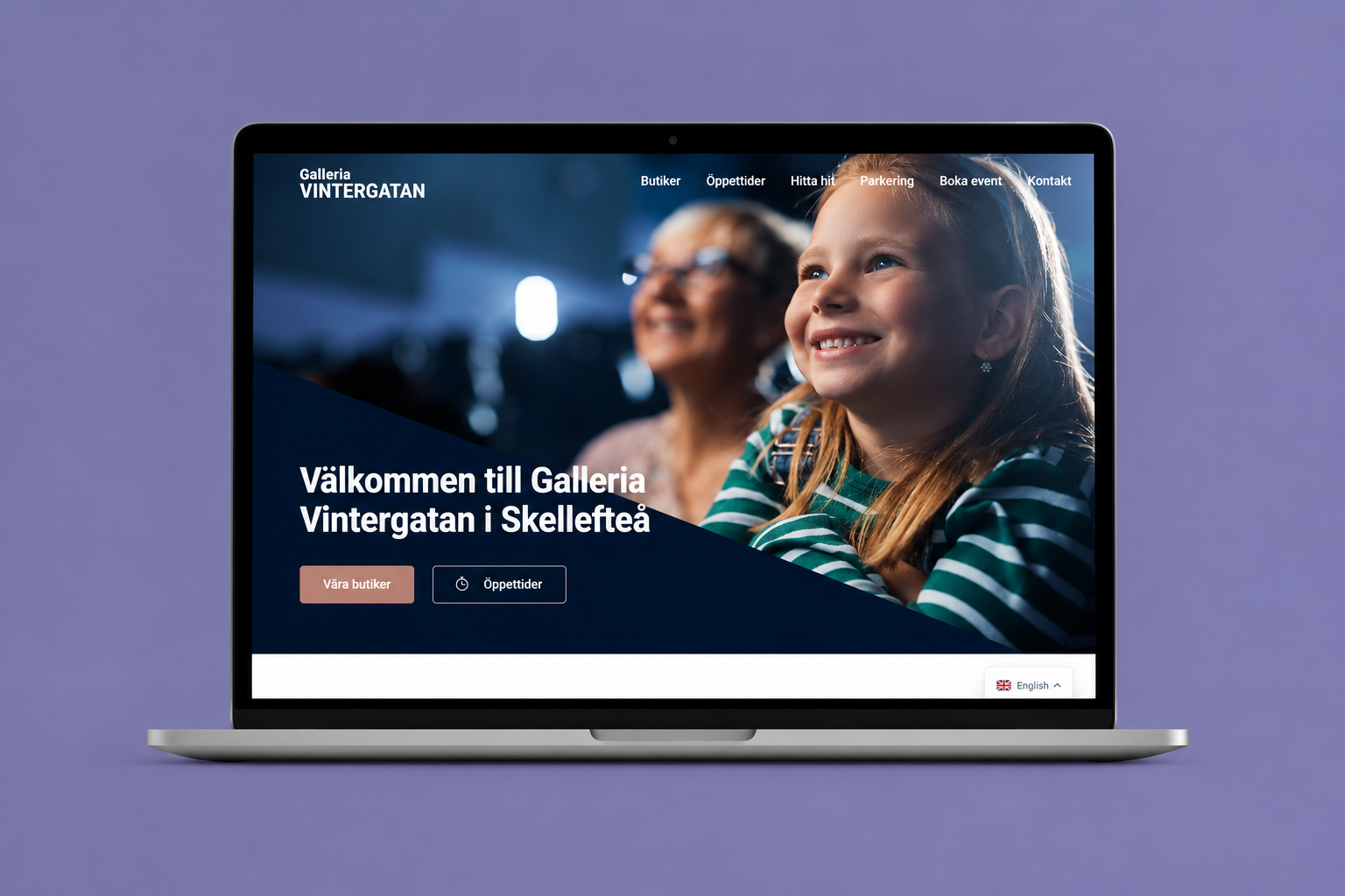 Galleria Vintergatans startsida på en laptop, med välkomstrubrik och ingångar till butiker och öppettider